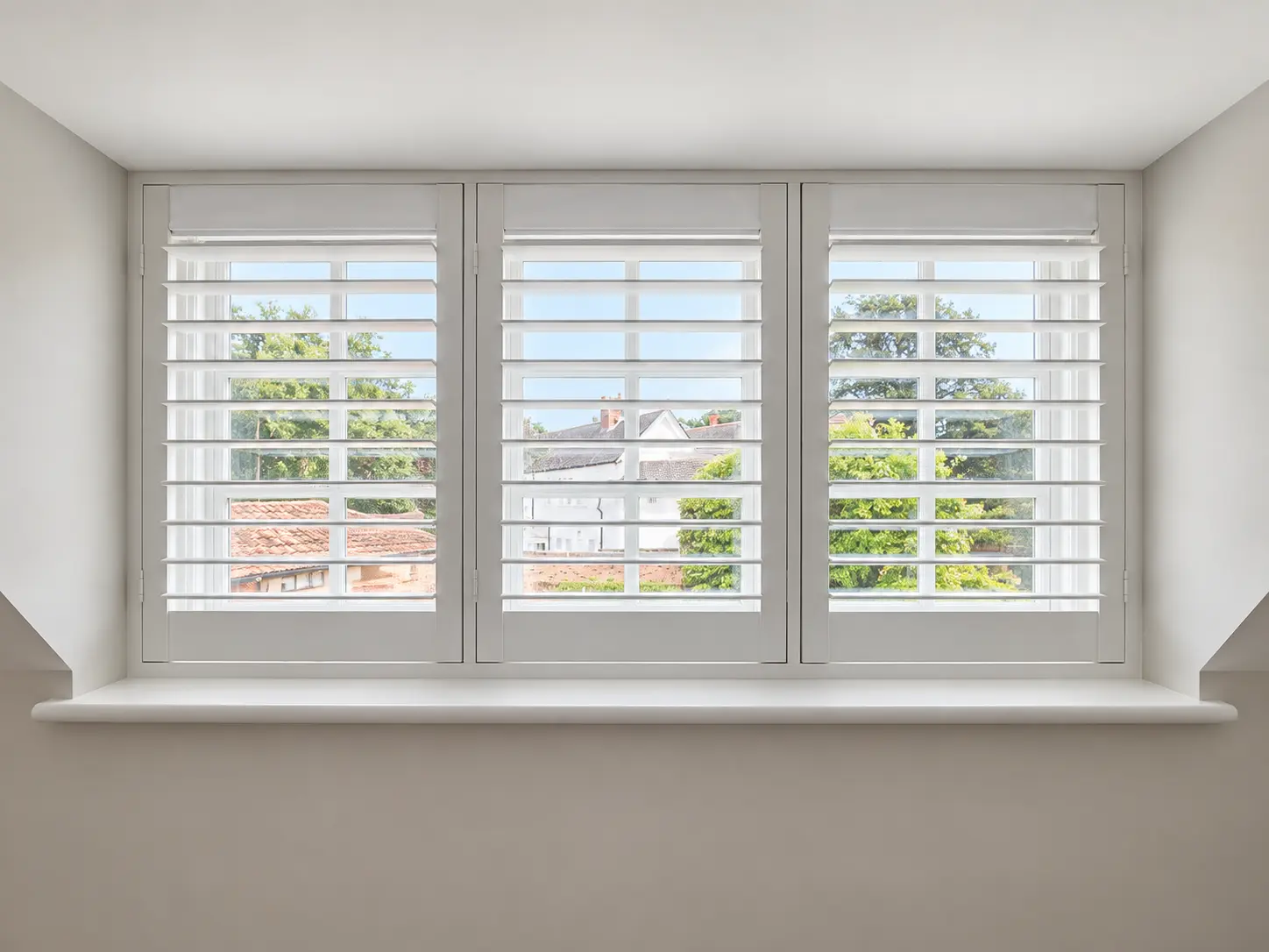 Full-height shutters across a wide hallway window in the Esher display house.