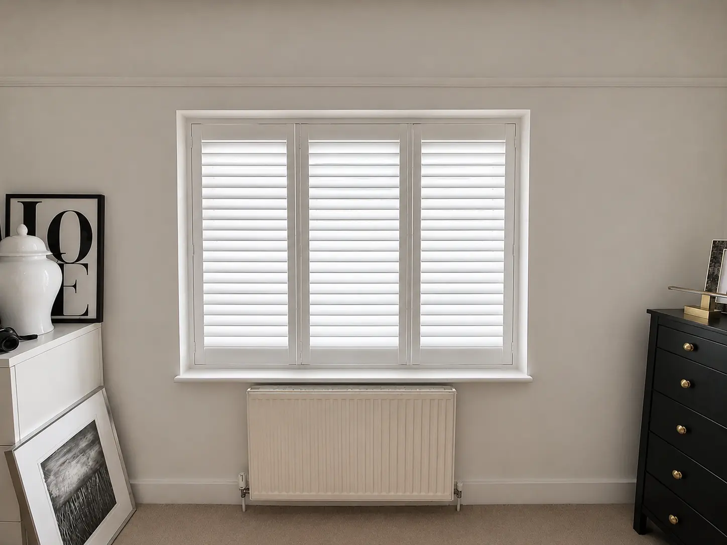Full-height plantation shutters fitted in an Epsom bedroom.